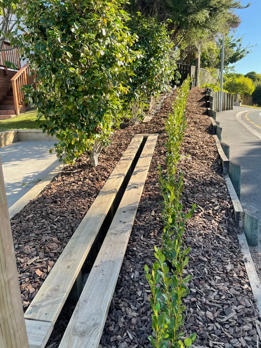 A garden bed in Nelson after weeding, mulching and planting