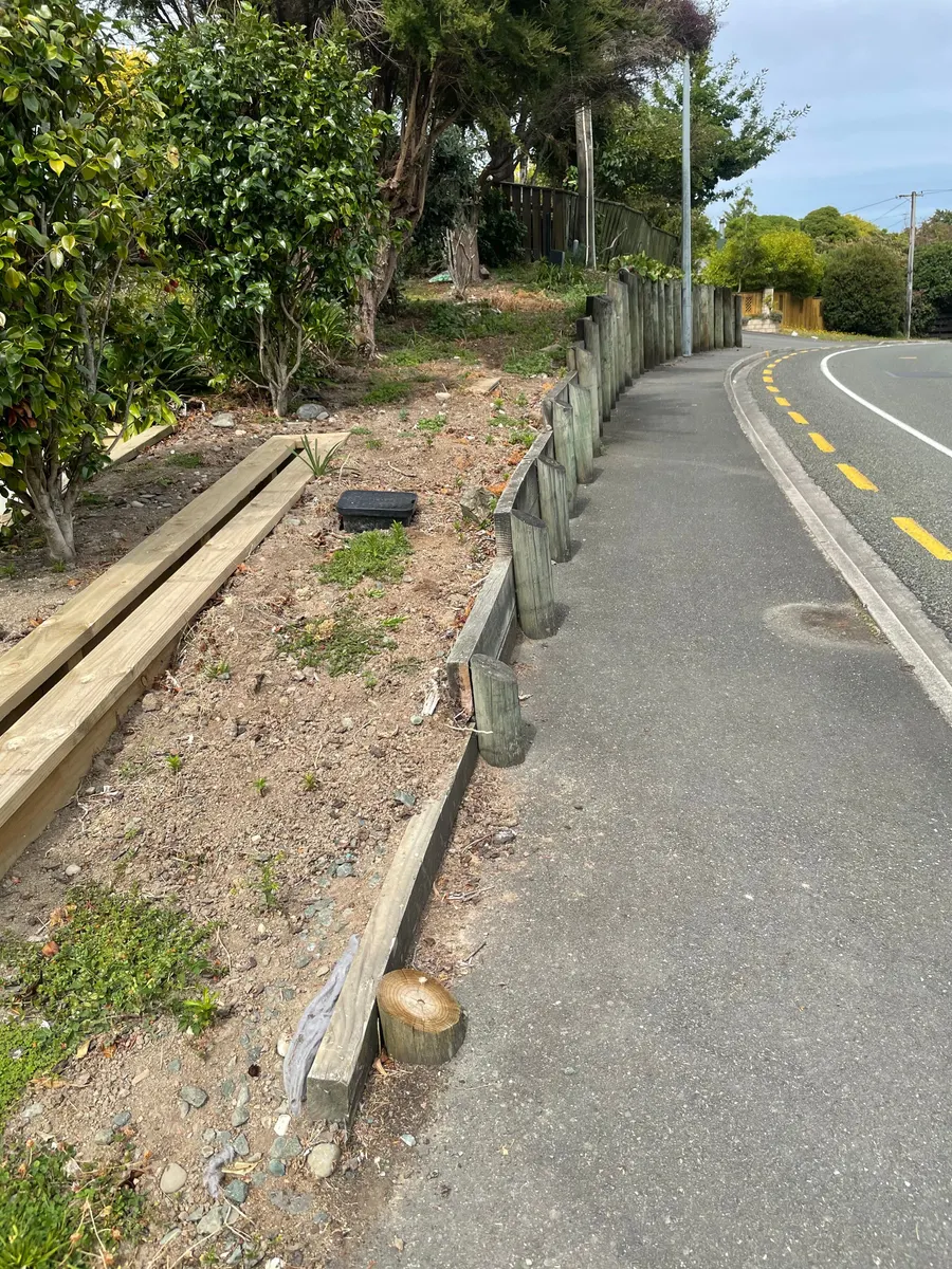 A weedy garden bed in Nelson before work