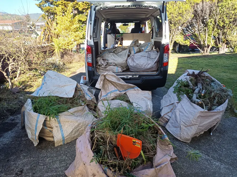 The All Incredible van loaded with bags of green waste in Nelson