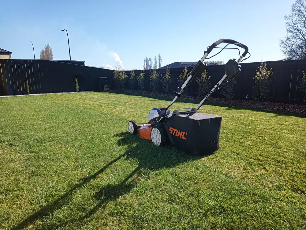 A push mower on a freshly striped lawn in Richmond