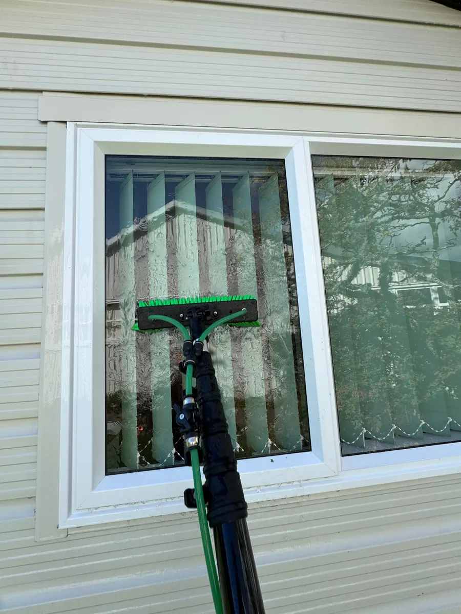 Exterior window cleaning in Nelson with a pure water pole